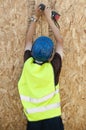 Worker with wooden panel with safety measures Royalty Free Stock Photo