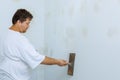 Worker work aligns with a spatula wall