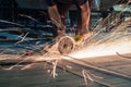 Worker working with a circular grinder