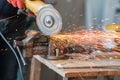 Worker working with a circular grinder