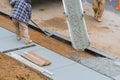 Worker working for concrete pavement for ground flooring construction Royalty Free Stock Photo