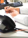 The worker is working with his computor in the office Royalty Free Stock Photo