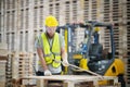 Worker are working at lumber yard in Large Warehouse. Royalty Free Stock Photo