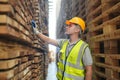 Worker are working at lumber yard in Large Warehouse. Royalty Free Stock Photo