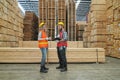 Worker are working at lumber yard in Large Warehouse. Royalty Free Stock Photo