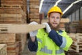 Worker are working at lumber yard in Large Warehouse. Royalty Free Stock Photo