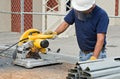 Worker Working with Saw