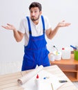 Worker working on wallpaper during refurbishment Royalty Free Stock Photo