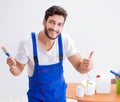 Worker working on wallpaper during refurbishment Royalty Free Stock Photo