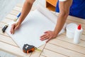 The worker working on wallpaper during refurbishment Royalty Free Stock Photo