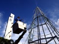 Worker works on a giant christmas tree