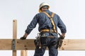 a worker works on a wooden scaffold isolated Royalty Free Stock Photo