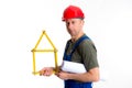 Worker with yardstick- house