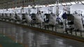 Workers assemble a car on assembly line in car factory