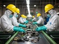 Workers assembling electronic components in a factory Royalty Free Stock Photo
