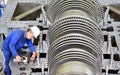 Workers assembling and quality control of gas turbines in a mode Royalty Free Stock Photo