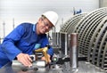 Workers assembling and quality control of gas turbines in a mode Royalty Free Stock Photo
