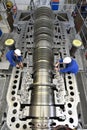 Workers assembling and quality control of gas turbines in a mode Royalty Free Stock Photo