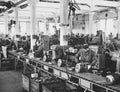 Workers at assembly line in factory