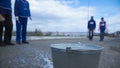 Workers in blue are ready to work for the city in outdoor. Clip. Closeup of a worker. Workers in blue dip the brush in Royalty Free Stock Photo