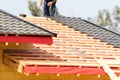 Workers build a roof on the house. Royalty Free Stock Photo