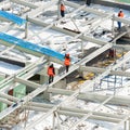 Workers on the building roof Royalty Free Stock Photo