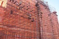 Workers building scaffolding on the wall of Taj Mahal complex in