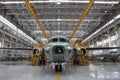 Workers are busy assembling a commercial aircraft inside a spacious hangar. The bright lighting highlights various tools and Royalty Free Stock Photo