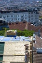 Workers carry out repair work on the roof of the building