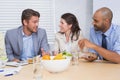 Workers chatting while enjoying healthy lunch Royalty Free Stock Photo