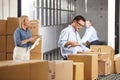 Workers Checking Goods On Belt In Distribution Warehouse Royalty Free Stock Photo