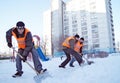 Workers clean snow