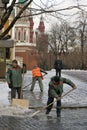 Workers clean snow in Moscow Kremlin.