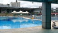 Shenzhen, China: Workers clean and prepare for the opening of a swimming pool at the sports center