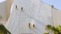 Workers cleaning facade of building with water jet pressure method. Industrial