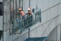 Workers cleaning high-rise buildings are at work in the capital city of Jakarta