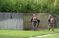 Workers cleaning lawn in park from Dead Leaves Royalty Free Stock Photo