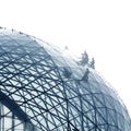 Workers cleaning a round glass facade Royalty Free Stock Photo