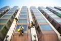 Workers cleaning the windows on the glass building Royalty Free Stock Photo