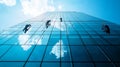 Workers cleaning windows on a modern skyscraper Royalty Free Stock Photo