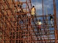 Workers climb iron scaffolding Royalty Free Stock Photo