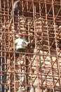 Workers climb iron scaffolding Royalty Free Stock Photo