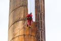 Workers climbing on the big chimney Royalty Free Stock Photo