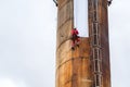 Workers climbing on the big chimney Royalty Free Stock Photo