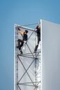 Workers climbing on scaffolding Royalty Free Stock Photo