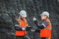 Workers with coal at open pit Royalty Free Stock Photo
