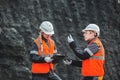 Workers with coal at open pit