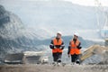 Workers with coal at open pit Royalty Free Stock Photo