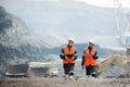 Workers with coal at open pit