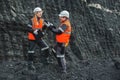 Workers with coal at open pit Royalty Free Stock Photo